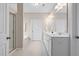 Bathroom featuring dual sinks, white cabinets, and a glass-enclosed shower at 3909 Mendenhall Dr, Zebulon, NC 27597