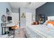 Inviting bedroom with a bed, a desk, and orange accents against gray and blue walls, offering a modern feel at 3909 Mendenhall Dr, Zebulon, NC 27597