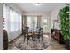 Dining room with a round table, seating for four, and natural light at 3909 Mendenhall Dr, Zebulon, NC 27597
