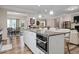 Open-concept kitchen island with granite countertops and built-in oven at 3909 Mendenhall Dr, Zebulon, NC 27597