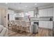 Bright kitchen with white cabinets, stainless steel appliances, and granite countertops at 3909 Mendenhall Dr, Zebulon, NC 27597