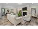 Spacious living room featuring a fireplace, modern furnishings, and an open-concept design at 3909 Mendenhall Dr, Zebulon, NC 27597