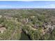 Serene aerial shot of homes nestled amongst the trees near a beautiful lake community at 3940 Lake Ferry Dr, Raleigh, NC 27606