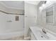A clean bathroom features a vanity with a mosaic mirror and a shower-tub with white subway tiles at 3940 Lake Ferry Dr, Raleigh, NC 27606