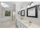 Bathroom with double sink vanity, tile floors, and shower-tub combination at 3940 Lake Ferry Dr, Raleigh, NC 27606