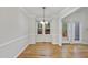 A bright dining area with hardwood floors and a window showcases the outdoor view at 3940 Lake Ferry Dr, Raleigh, NC 27606