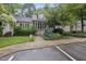 Charming home featuring a well-manicured front yard with a welcoming walkway and tasteful landscaping at 3940 Lake Ferry Dr, Raleigh, NC 27606