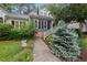 Charming home featuring a well-manicured front yard with a welcoming walkway and tasteful landscaping at 3940 Lake Ferry Dr, Raleigh, NC 27606