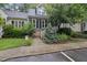 Charming home featuring a well-manicured front yard with a welcoming walkway and tasteful landscaping at 3940 Lake Ferry Dr, Raleigh, NC 27606