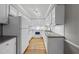 A well-lit kitchen boasts white cabinetry, granite countertops, and hardwood flooring at 3940 Lake Ferry Dr, Raleigh, NC 27606