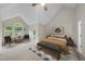 Spacious main bedroom with high ceilings, carpet, and large windows for natural light at 3940 Lake Ferry Dr, Raleigh, NC 27606