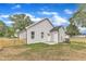 Backyard features a well-maintained lawn, wooden fence and a new construction at 401 N Raiford St, Selma, NC 27576