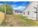 View of the backyard features a new fence and new construction at 401 N Raiford St, Selma, NC 27576