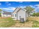 Shot of fenced-in backyard and home exterior on a sunny day at 401 N Raiford St, Selma, NC 27576