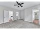 Spacious bedroom with carpet flooring and multiple doors to the bathroom and walk-in closet at 401 N Raiford St, Selma, NC 27576