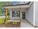 Inviting front porch featuring craftsman columns and manicured landscaping at 401 N Raiford St, Selma, NC 27576