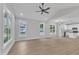 Bright living room featuring lots of natural light, high ceilings, and luxury vinyl plank flooring at 401 N Raiford St, Selma, NC 27576