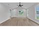 Bright living room featuring luxury vinyl plank flooring and a white interior paint at 401 N Raiford St, Selma, NC 27576