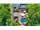 Expansive backyard with a pool, patio, and lush landscaping, perfect for outdoor entertaining at 404 Brightling Way, Holly Springs, NC 27540