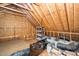 Unfinished attic space with exposed beams and plenty of room for storage, insulation, and ductwork at 404 Brightling Way, Holly Springs, NC 27540