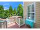 Scenic balcony offers views of the pool and lush greenery at 404 Brightling Way, Holly Springs, NC 27540
