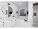 Bright bathroom with a vanity, bathtub, and plenty of natural light at 404 Brightling Way, Holly Springs, NC 27540