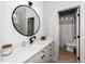 Well-lit bathroom with a spacious vanity and modern black fixtures at 404 Brightling Way, Holly Springs, NC 27540