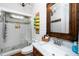 Bathroom featuring a vanity, glass enclosed shower, and decorative towel rack at 404 Brightling Way, Holly Springs, NC 27540