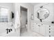 Bright bathroom featuring tub, vanity, and a large window for natural light at 404 Brightling Way, Holly Springs, NC 27540