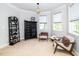 Cozy bedroom with reading nook featuring natural light and space for custom wardrobe at 404 Brightling Way, Holly Springs, NC 27540
