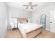 Comfortable bedroom featuring a ceiling fan and lots of light at 404 Brightling Way, Holly Springs, NC 27540