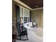 Charming front porch with rocking chairs and bench, perfect for enjoying the outdoors in a comfortable and inviting space at 404 Brightling Way, Holly Springs, NC 27540