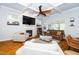 Cozy living room with coffered ceilings, fireplace, hardwood floors, and plush seating, creating a welcoming atmosphere at 404 Brightling Way, Holly Springs, NC 27540