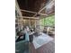 Cozy screened-in porch with comfortable seating, stylish decor, and a ceiling fan, creating a relaxing outdoor living space at 404 Brightling Way, Holly Springs, NC 27540