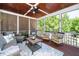 Relaxing screened patio with comfortable seating and an outdoor rug at 404 Brightling Way, Holly Springs, NC 27540