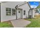 Exterior shot showing a patio, grass, and white siding with a fence at 405 N Raiford St, Selma, NC 27576