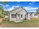 Backyard featuring a white home exterior with a privacy fence at 405 N Raiford St, Selma, NC 27576