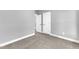Spacious bedroom with plush carpet and white paneled doors at 405 N Raiford St, Selma, NC 27576