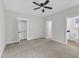 Spacious bedroom with a ceiling fan and walk in closet, and an ensuite bathroom at 405 N Raiford St, Selma, NC 27576