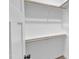 Walk in closet with wooden rods for hanging and a shelf for storing personal items at 405 N Raiford St, Selma, NC 27576