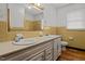 Bathroom featuring double sinks and a clean, well-lit mirror at 407 W Depot St, Angier, NC 27501