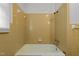 Bright bathroom featuring a clean bathtub and tiled walls at 407 W Depot St, Angier, NC 27501