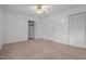 Bedroom featuring carpeted floors, a ceiling fan with lighting, and a closet at 407 W Depot St, Angier, NC 27501