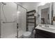 Bathroom with white tiled shower and dark wood vanity with sink at 420 Creekhurst Pl, Cary, NC 27519