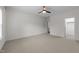Spacious bedroom with neutral walls and large window with attached walk-in closet for convenient storage solutions at 420 Creekhurst Pl, Cary, NC 27519