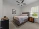 Bedroom with neutral colors, a ceiling fan, and natural light at 420 Creekhurst Pl, Cary, NC 27519