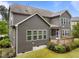 Exterior home view with backyard screened-in porch and landscaping at 420 Creekhurst Pl, Cary, NC 27519