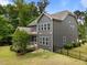 Exterior rear view of house highlighting the backyard, landscaping, and screened porch at 420 Creekhurst Pl, Cary, NC 27519