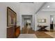 Elegant foyer featuring hardwood floors, high ceilings, stylish console table, and tasteful decor at 420 Creekhurst Pl, Cary, NC 27519