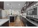 Bright and spacious kitchen with stainless steel appliances, hardwood floors, and open concept design at 420 Creekhurst Pl, Cary, NC 27519